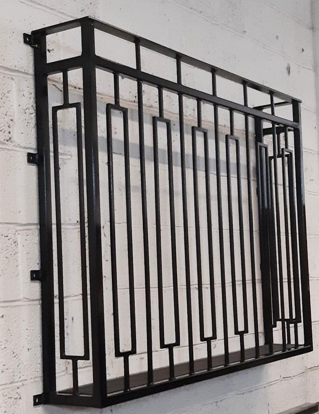 Hand forged Juliet balcony with composite decking floor. 88