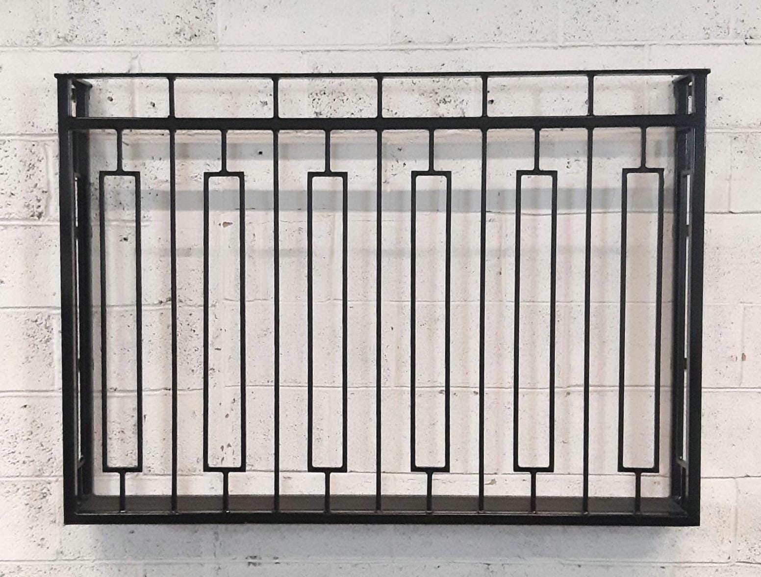 Hand forged Juliet balcony with composite decking floor. 88