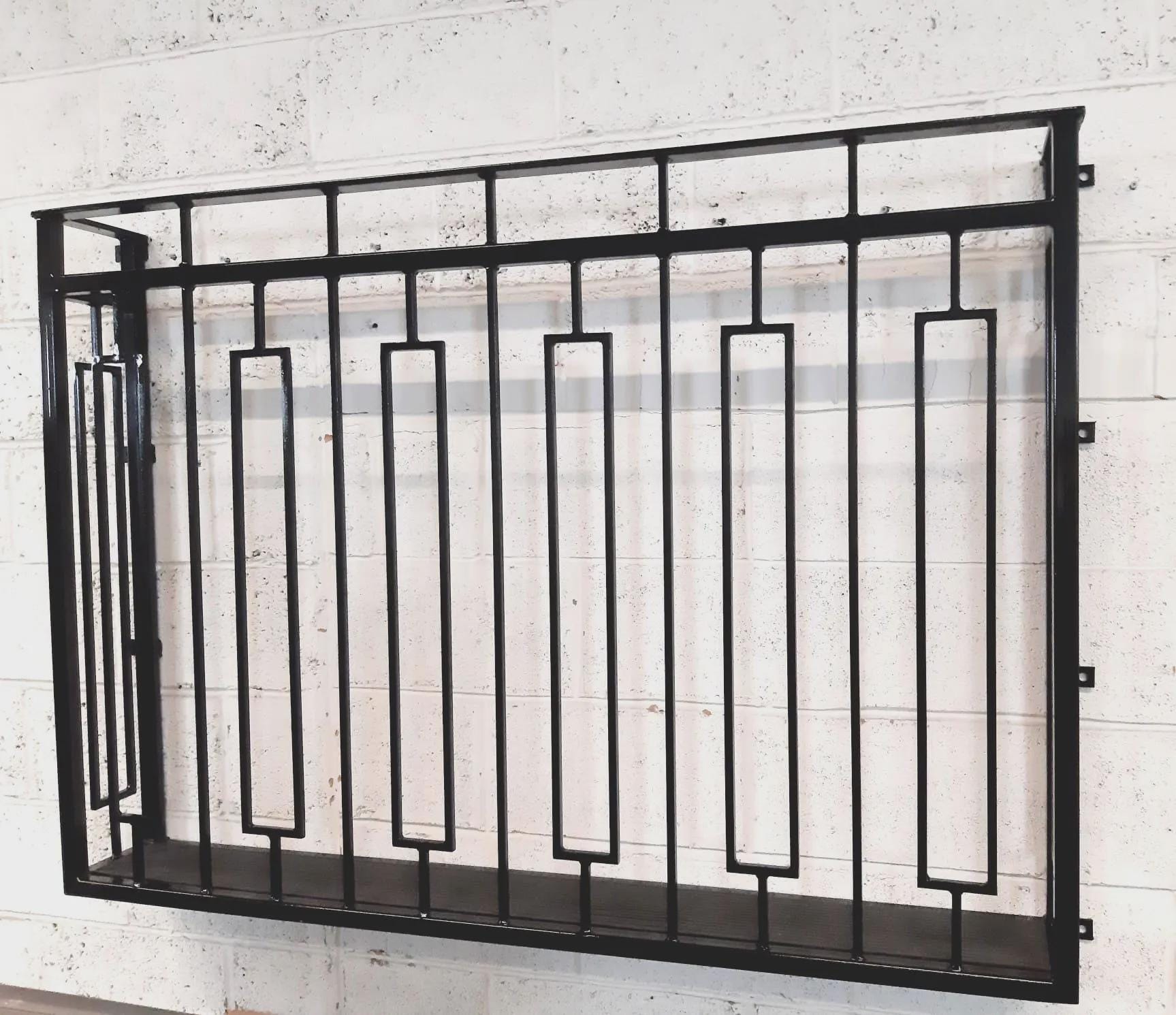Hand forged Juliet balcony with composite decking floor. 88