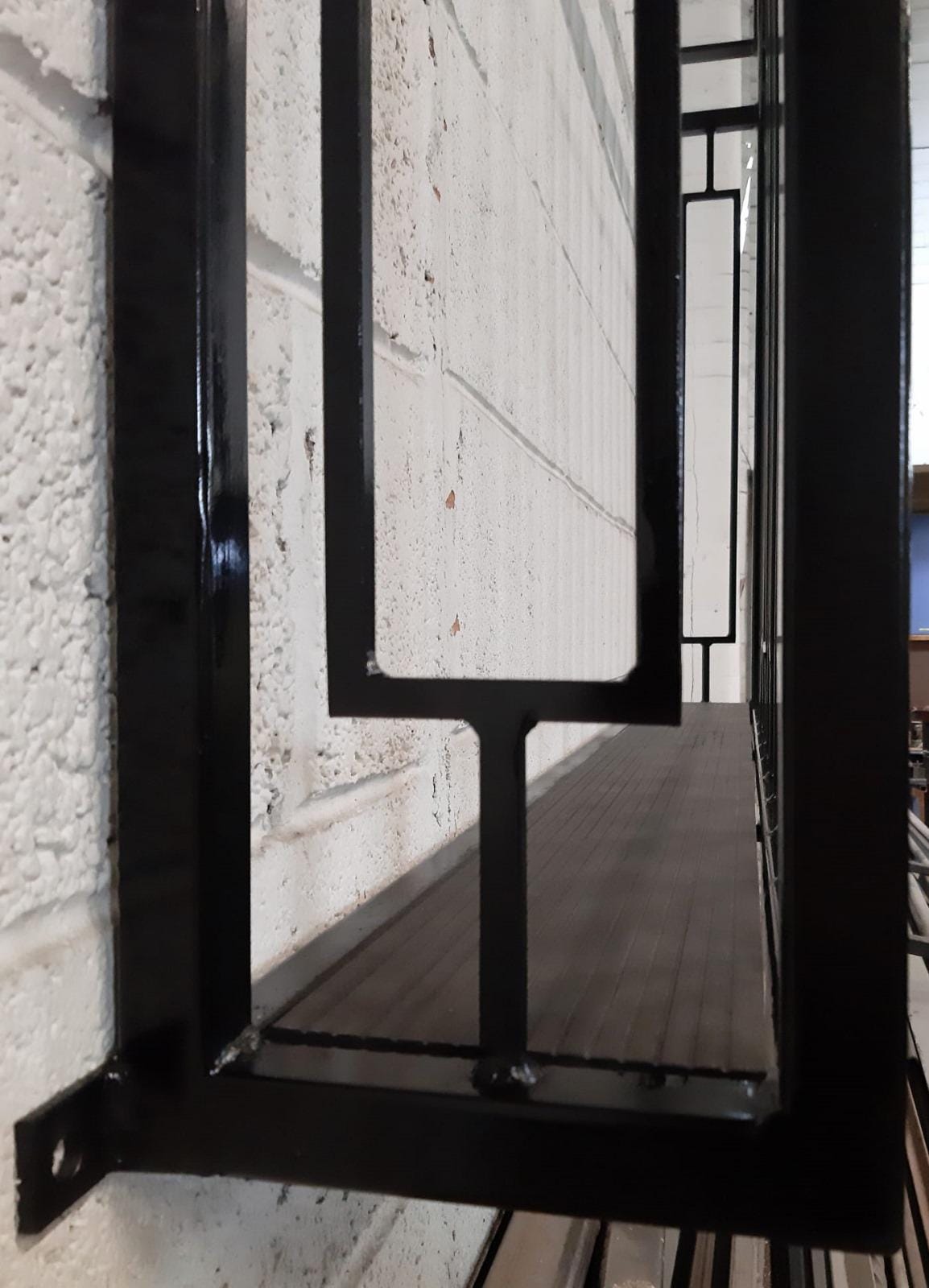Hand forged Juliet balcony with composite decking floor. 88