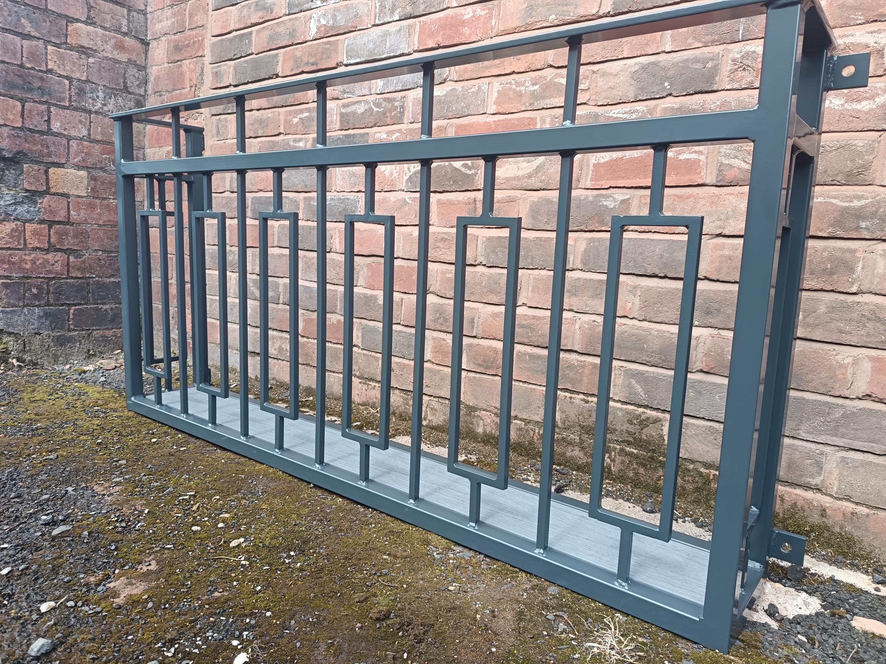 Hand forged Juliet balcony with composite decking floor. 88