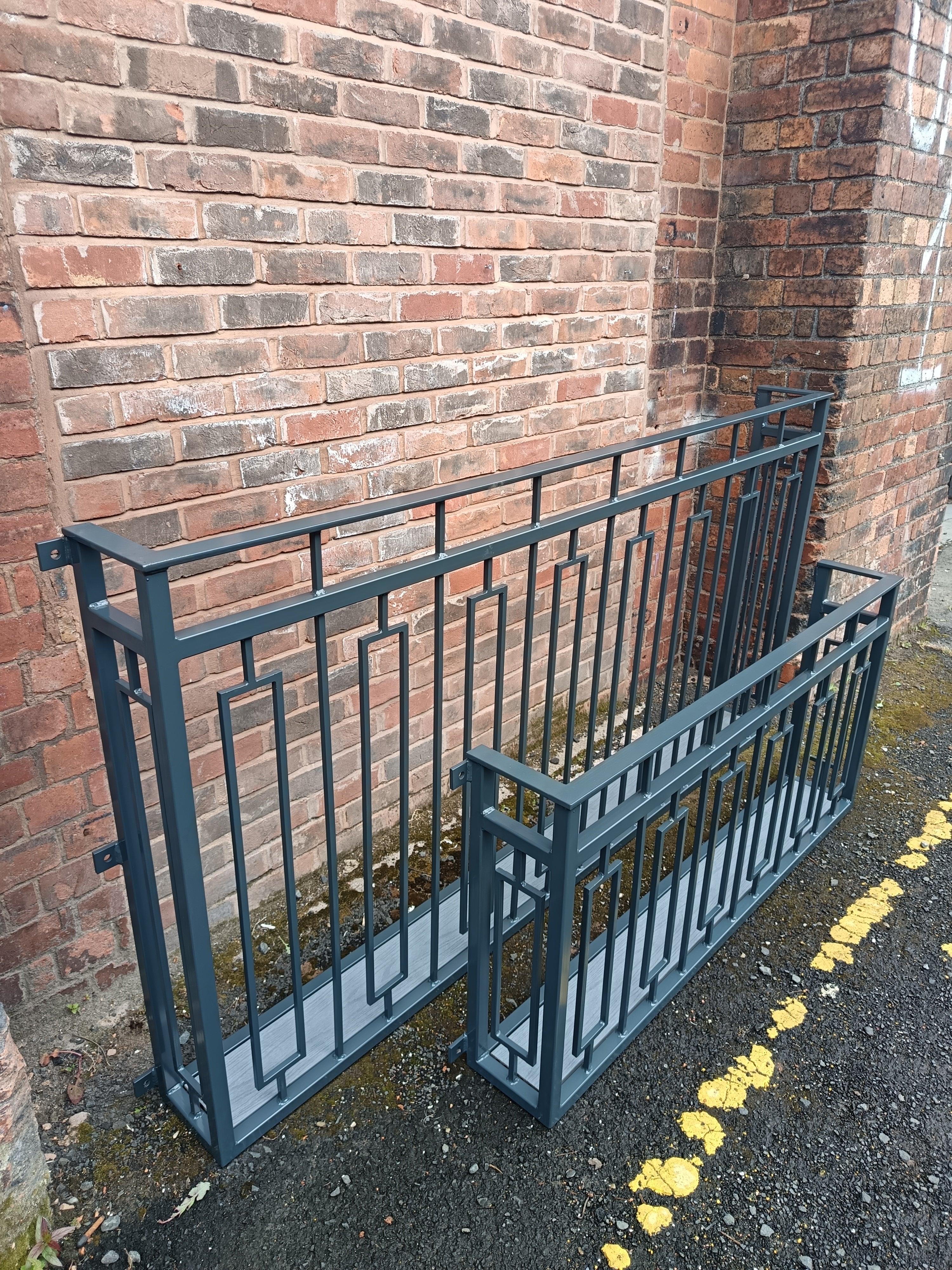 Hand forged Juliet balcony with composite decking floor. 88
