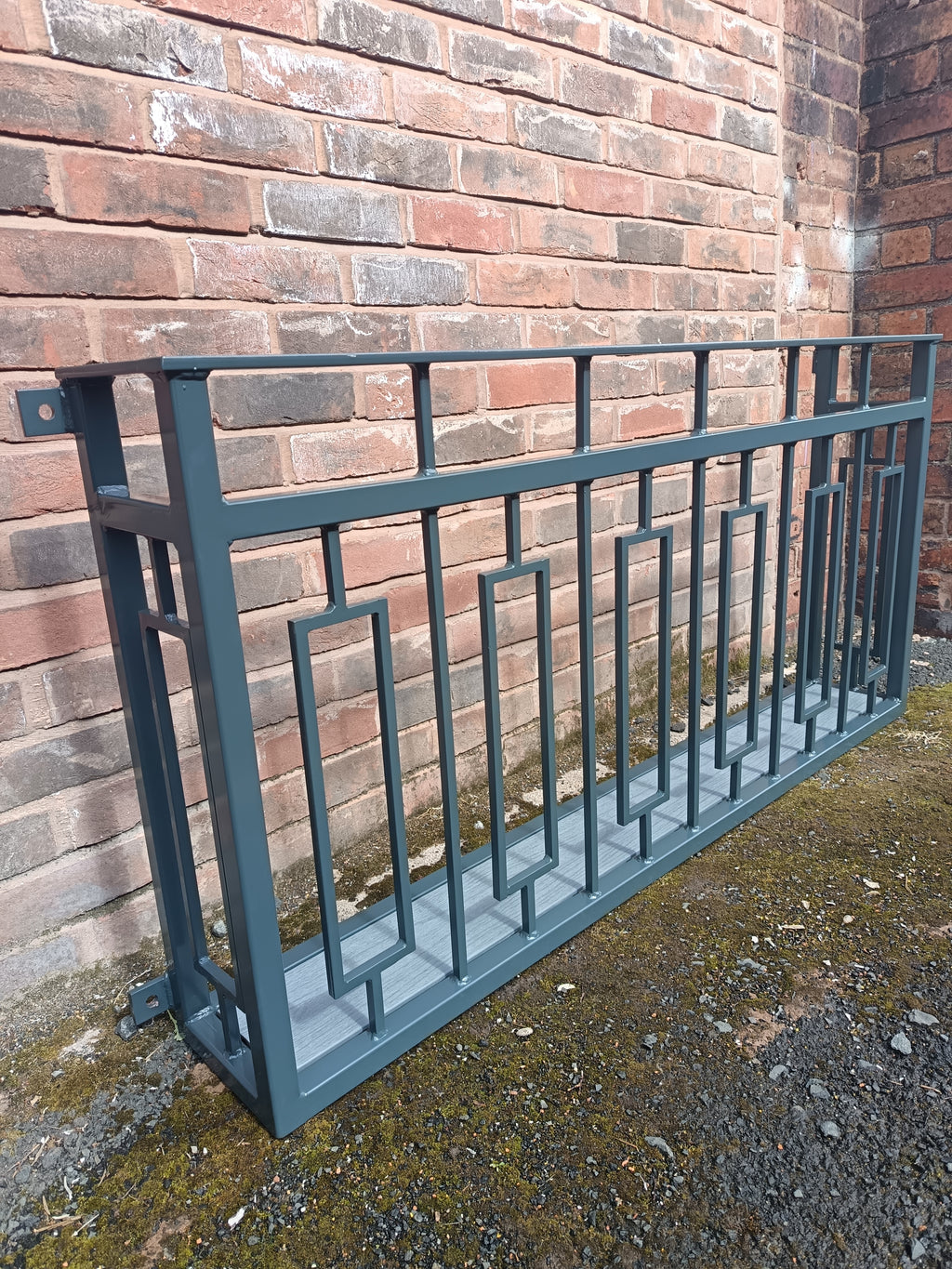 Hand forged Juliet balcony with composite decking floor. 88