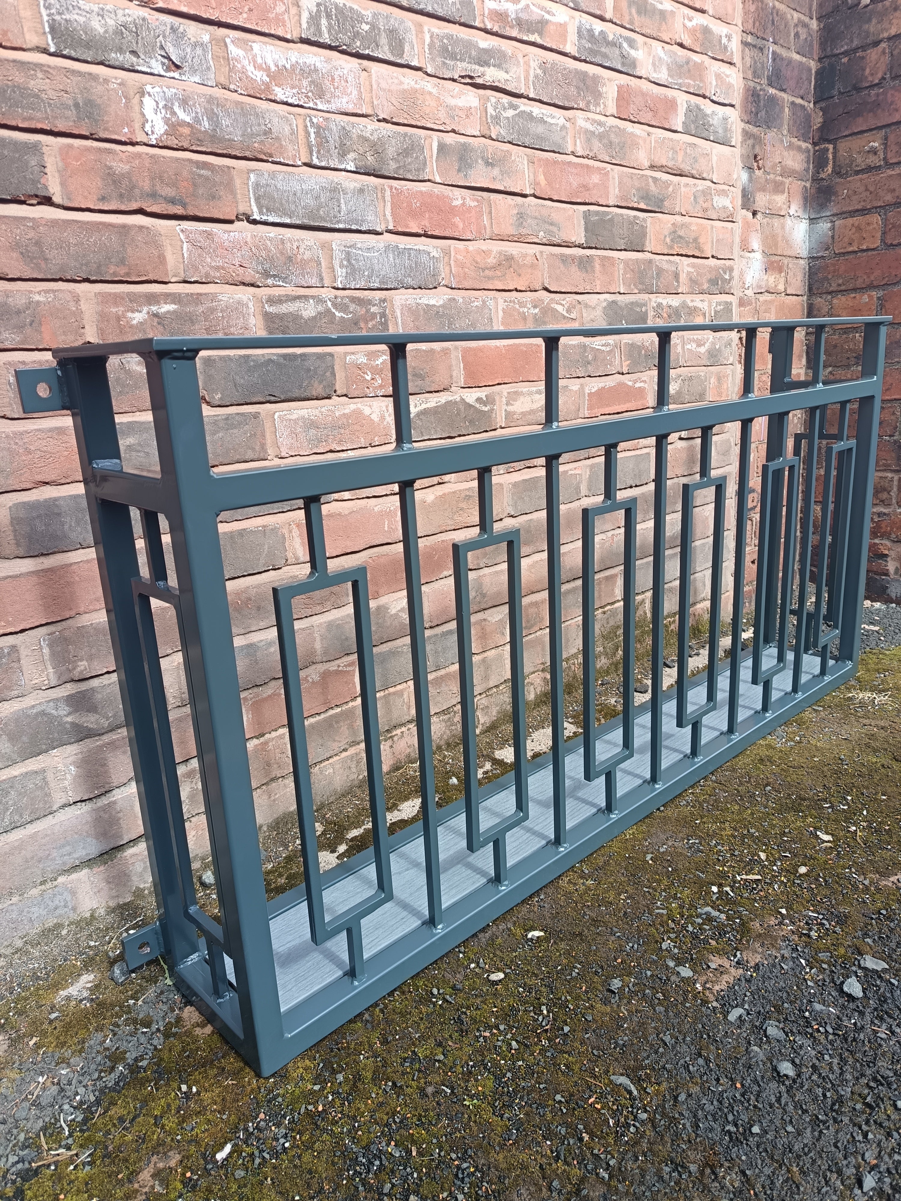 Hand forged Juliet balcony with composite decking floor. 88